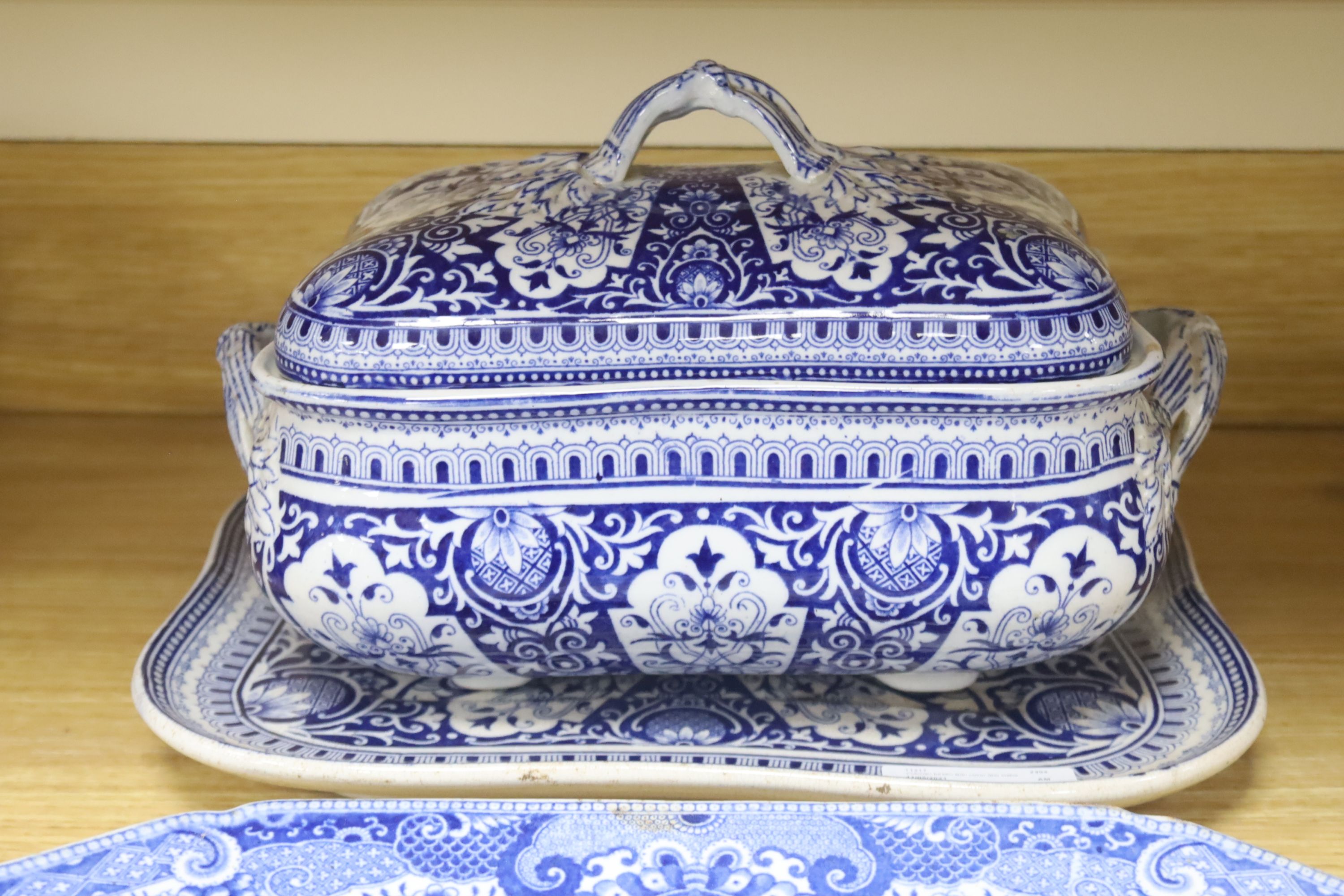 A blue and white meat dish decorated with a Chinese landscape pattern, and a Victorian blue and white tureen, cover and stand, height 17cm